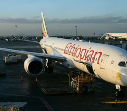 Kenya Airways and Ethiopian Airlines planes side by side at Nairobi airport.