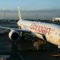 Kenya Airways and Ethiopian Airlines planes side by side at Nairobi airport.